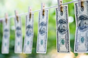 Hanging Hundred Dollar Bills on Clothes Line