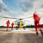 Emergency Personnel Rushing to Helicopter Ambulance