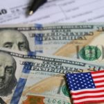 Hundred Dollar Bills with American Flag, and 1040 Tax Form