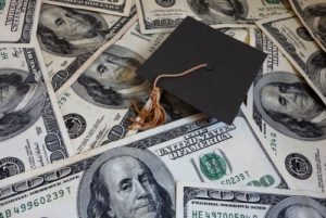 grad cap on hundred dollar bills