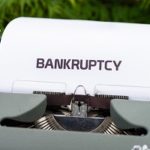typing of word bankruptcy on typewriter