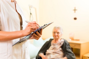 nurse checking elderly woman