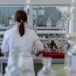Person wearing lab coat in laboratory