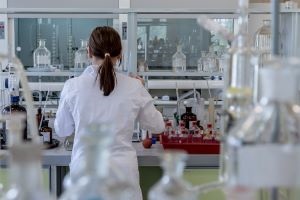 Person wearing lab coat in laboratory