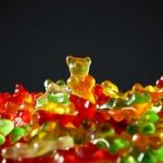 Stack of Multicolored Gummy Bears with One Standing