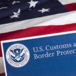 US Customs and Border Protection Flyer Behind US Flag